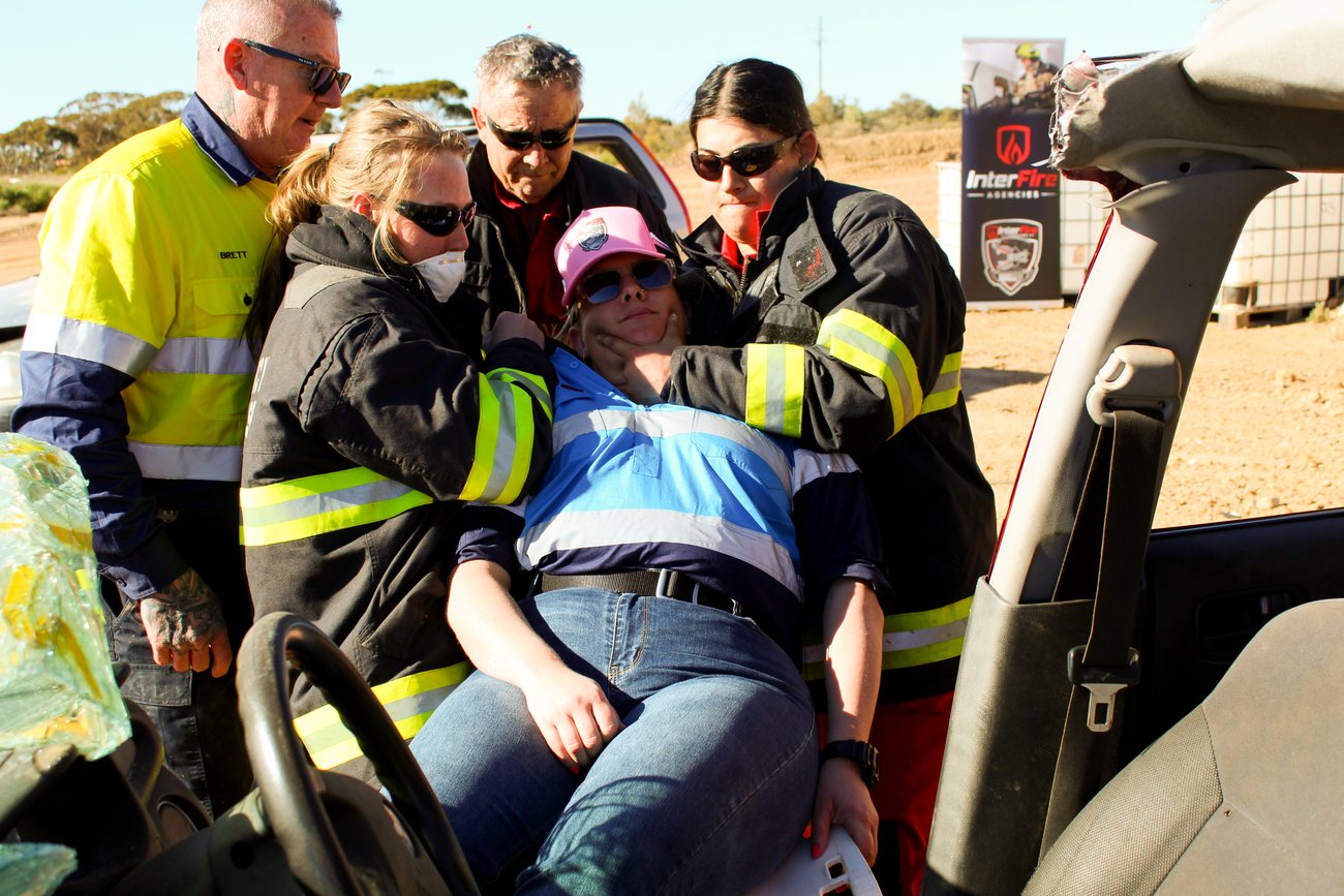 Responders providing casualty care through a vehicle during an extrication scenario